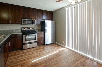 Kitchen includes dishwasher, microwave, and refrigerator (a)